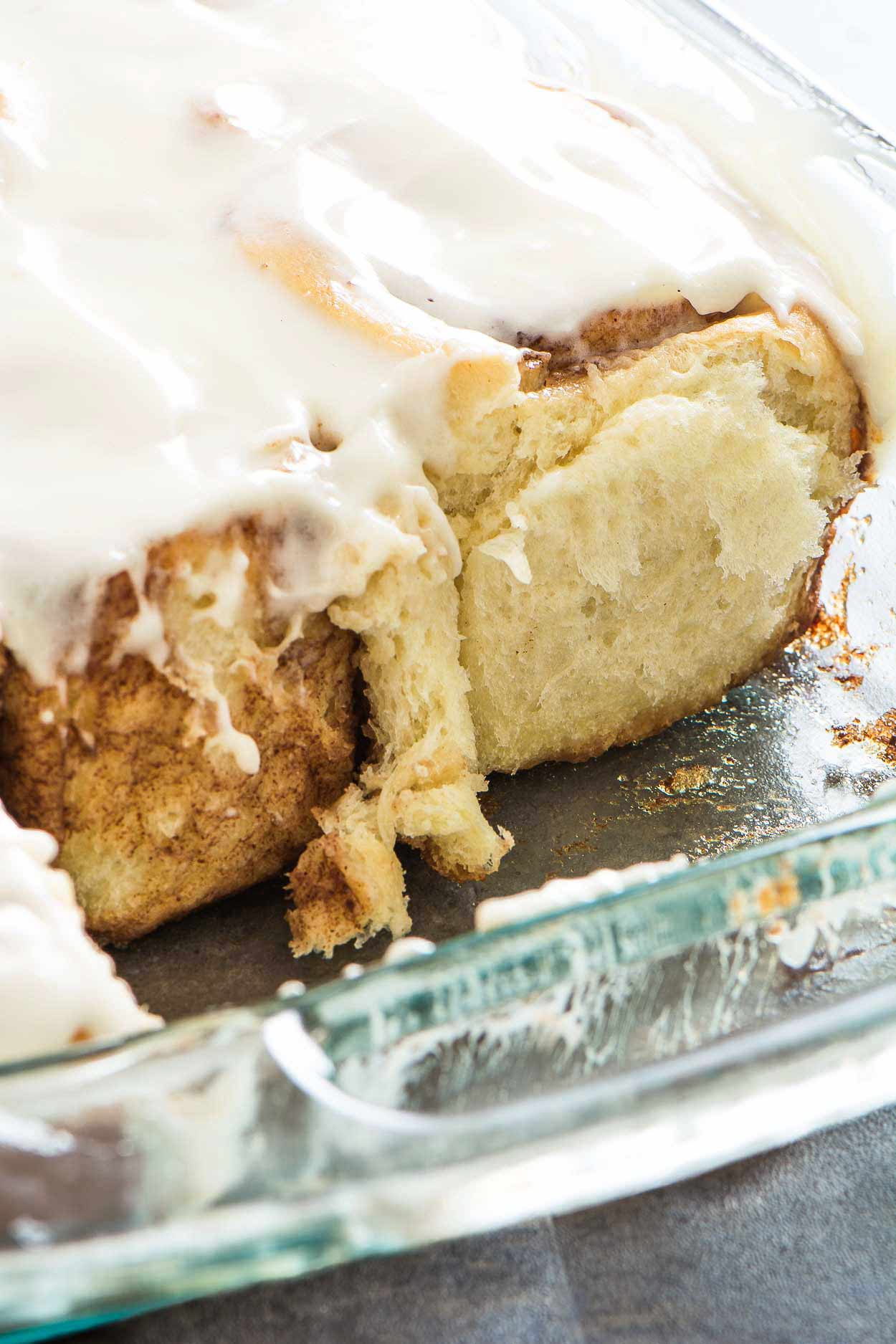 Made from scratch jumbo cinnamon rolls that are light and flaky. Filled with brown sugar, cinnamon and topped with a generous layer of cream cheese icing. | simplerevisions.com