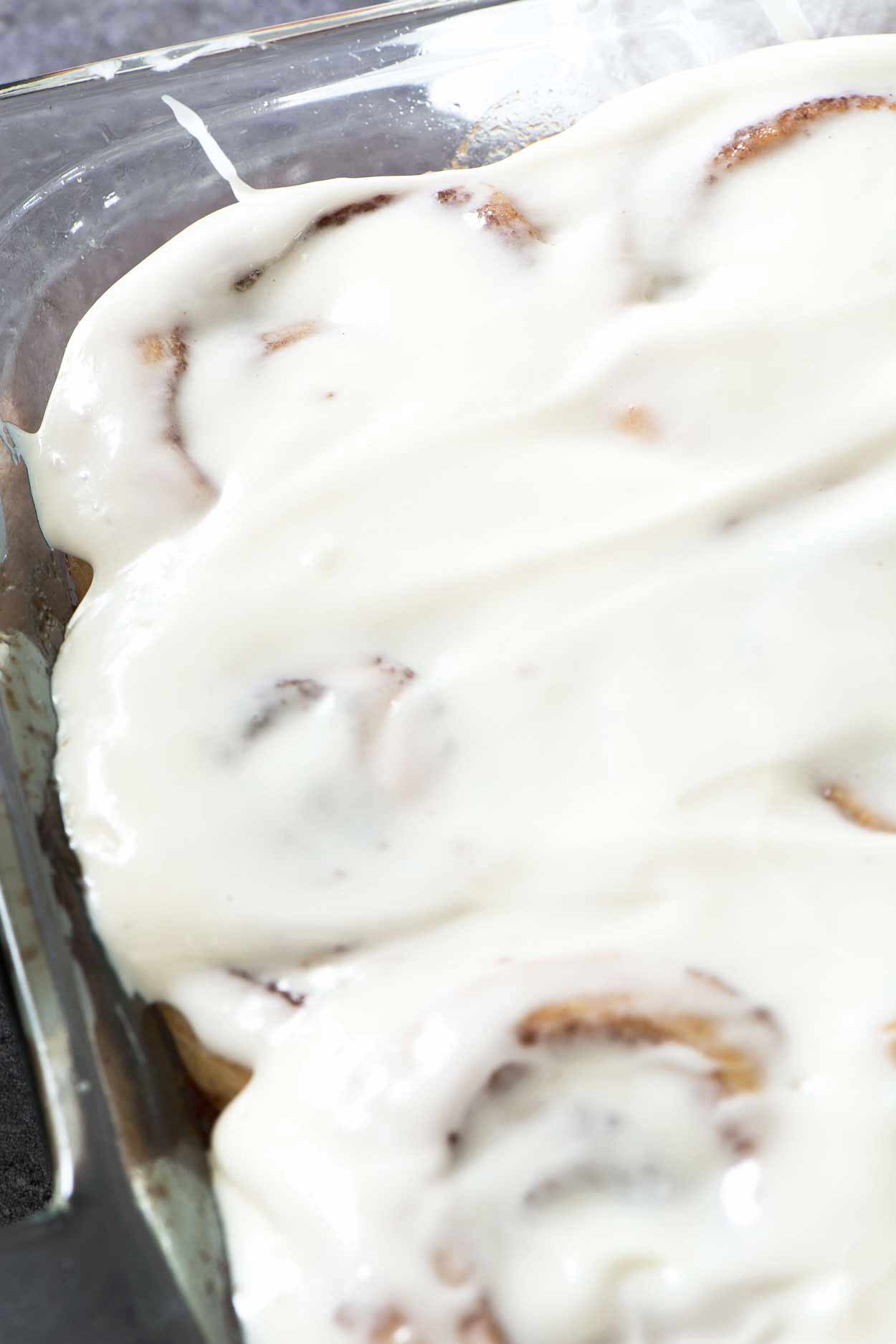 Made from scratch jumbo cinnamon rolls that are light and flaky. Filled with brown sugar, cinnamon and topped with a generous layer of cream cheese icing. | simplerevisions.com
