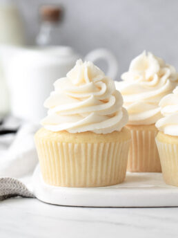 Vanilla Cupcakes with Buttercream Frosting on a white marble plate