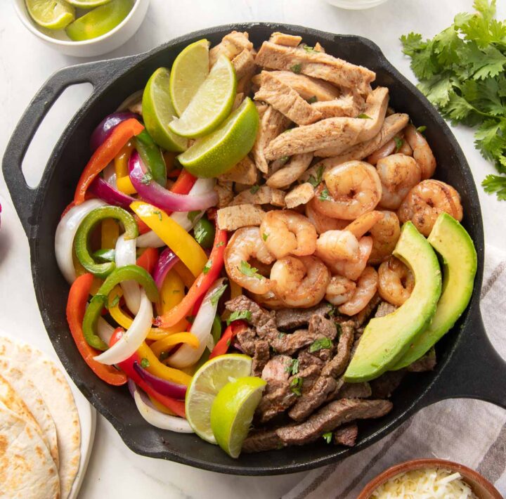 Chicken, Steak and Shrimp Fajitas with sautéed veggies