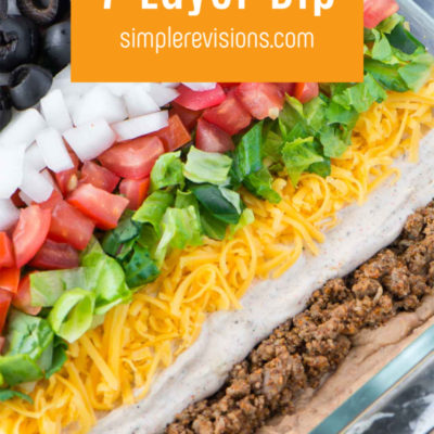 7 layer dip with meat in a glass baking dish