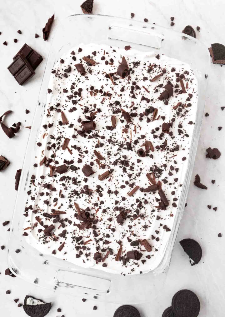 An overhead view of a whole chocolate in a clear 9x13 baking dish.