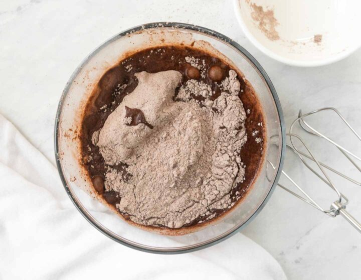 Instant chocolate pudding dry mix in a bowl with cold milk.
