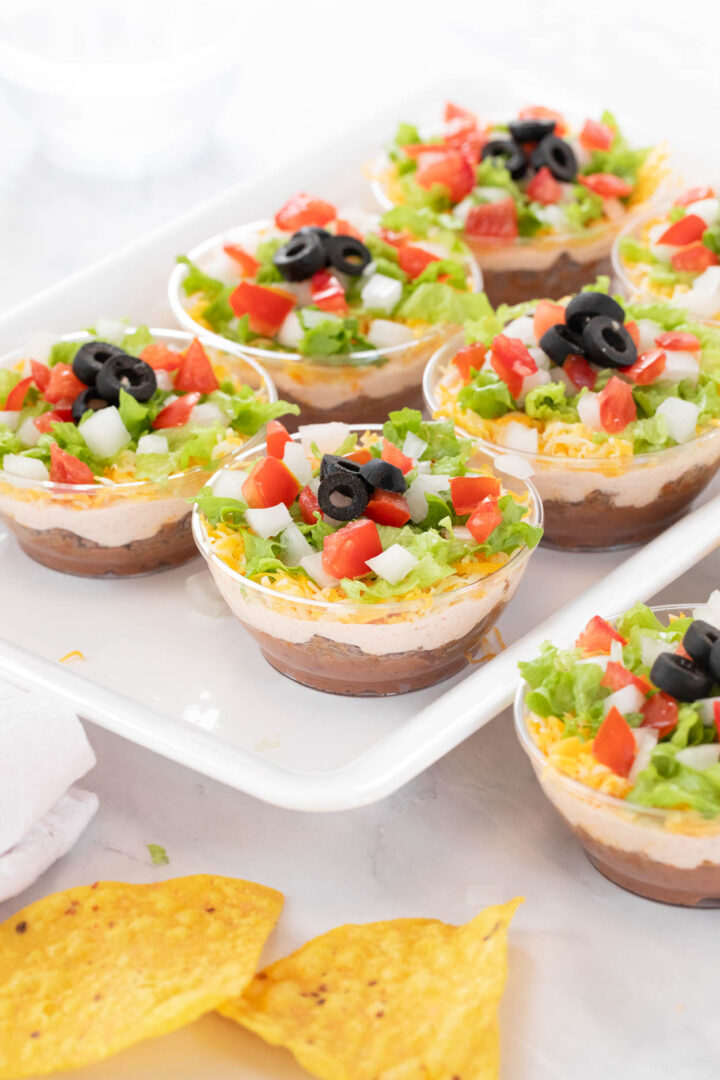 Individual 7 Layer Dip Cups on a serving tray